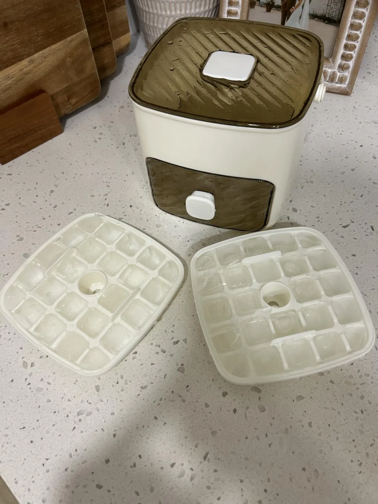 Ice cube tray set in use with prepared ice